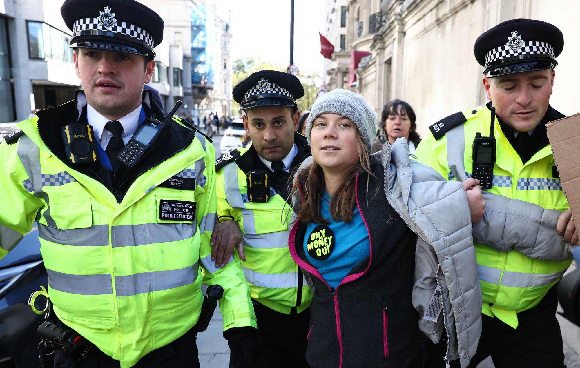 Swedish climate activist Greta Thunberg is arrested by police outside the InterContinental London Park Lane during the "Oily Money Out" demonstration organised by Fossil Free London and Greenpeace on the sidelines of the opening day of the Energy Intelligence Forum 2023 in London on October 17, 2023. (Photo by HENRY NICHOLLS / AFP) (Photo by HENRY NICHOLLS/AFP via Getty Images)